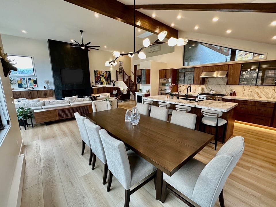 View from dining area into house. Table seats 8 + 4 add'l chairs & 4 barstools.