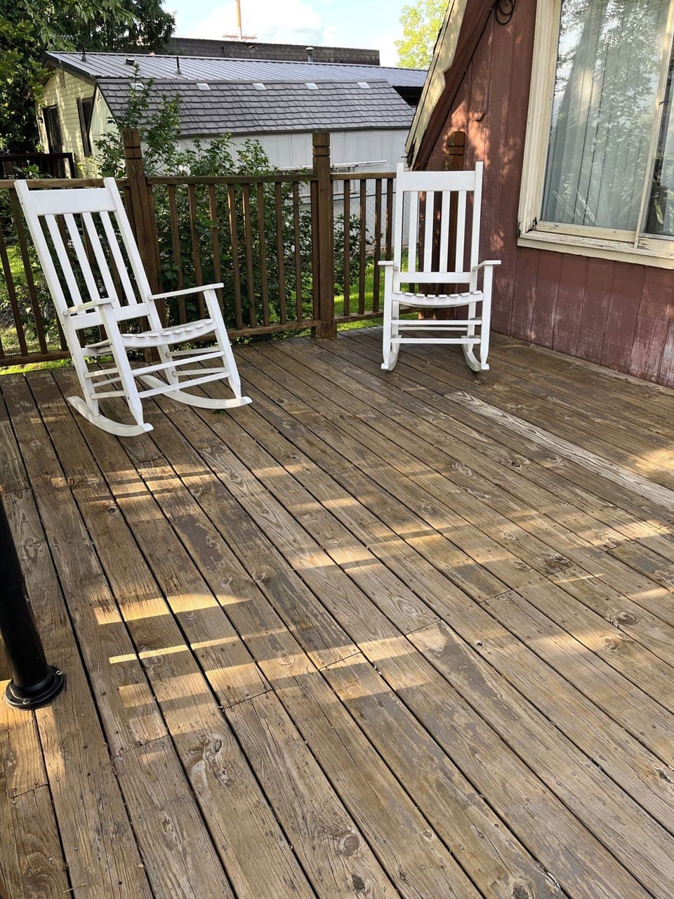 Large deck with 4 chairs.  Extra chairs in garage for fire pit or deck