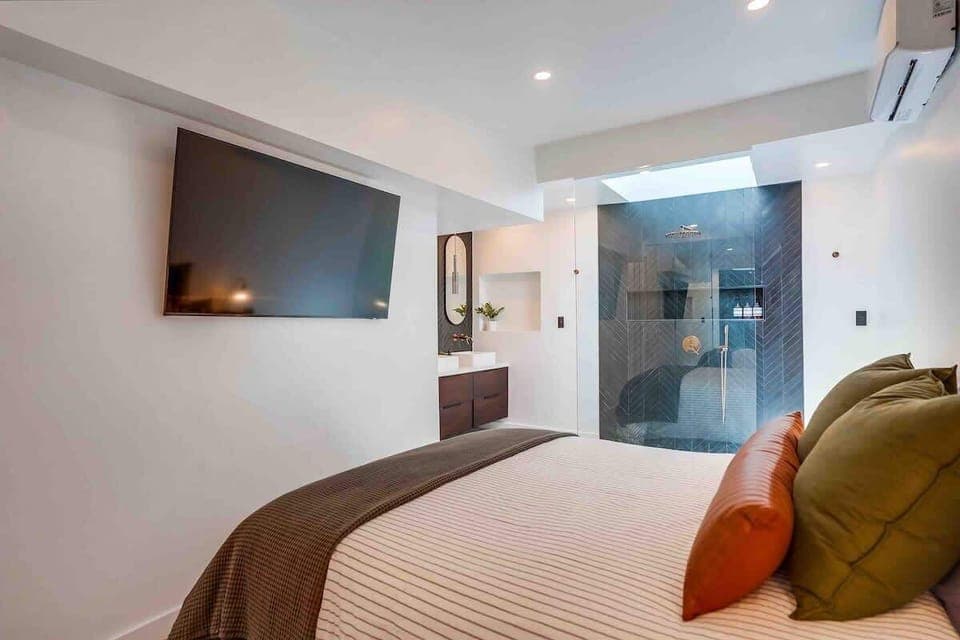 The bedroom also has a beautiful open shower and skylight. 