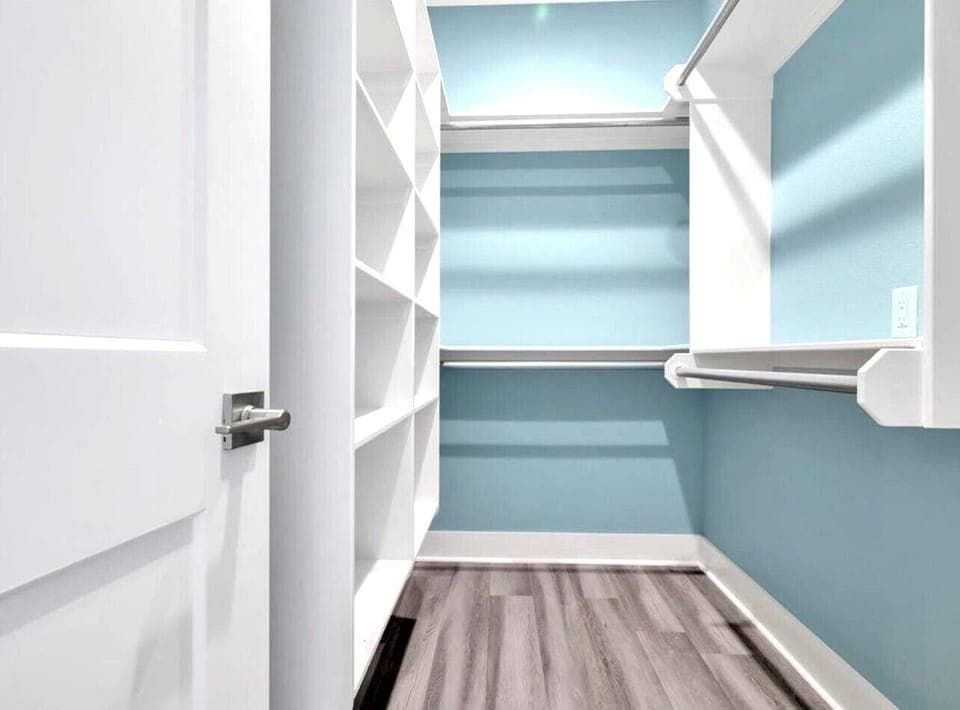Wow!  So much room to store overflow items in this large master closet.