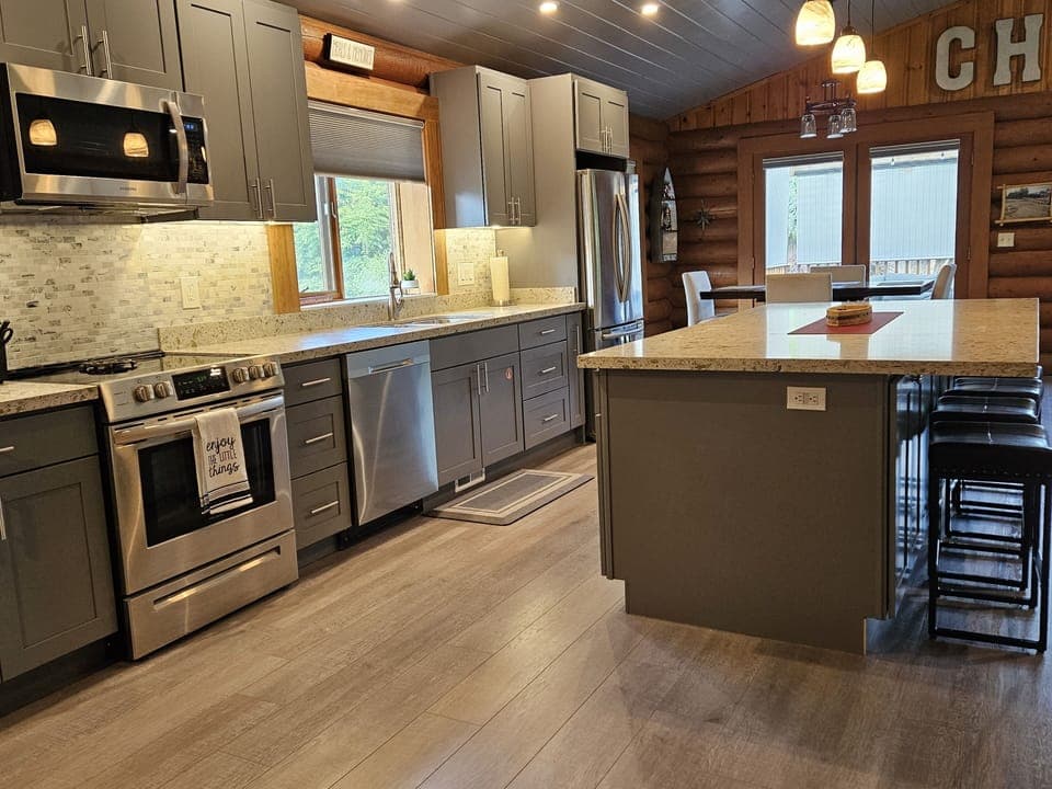Completely remodeled Kitchen with counter seating at large island.