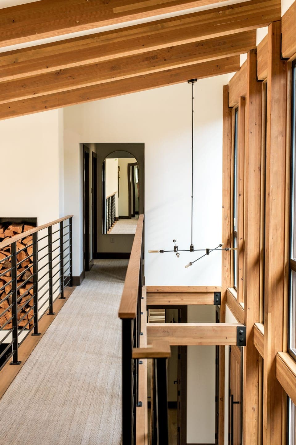 The upstairs cat-walk separates two mirroring bedrooms from another king bedroom and the bunk room