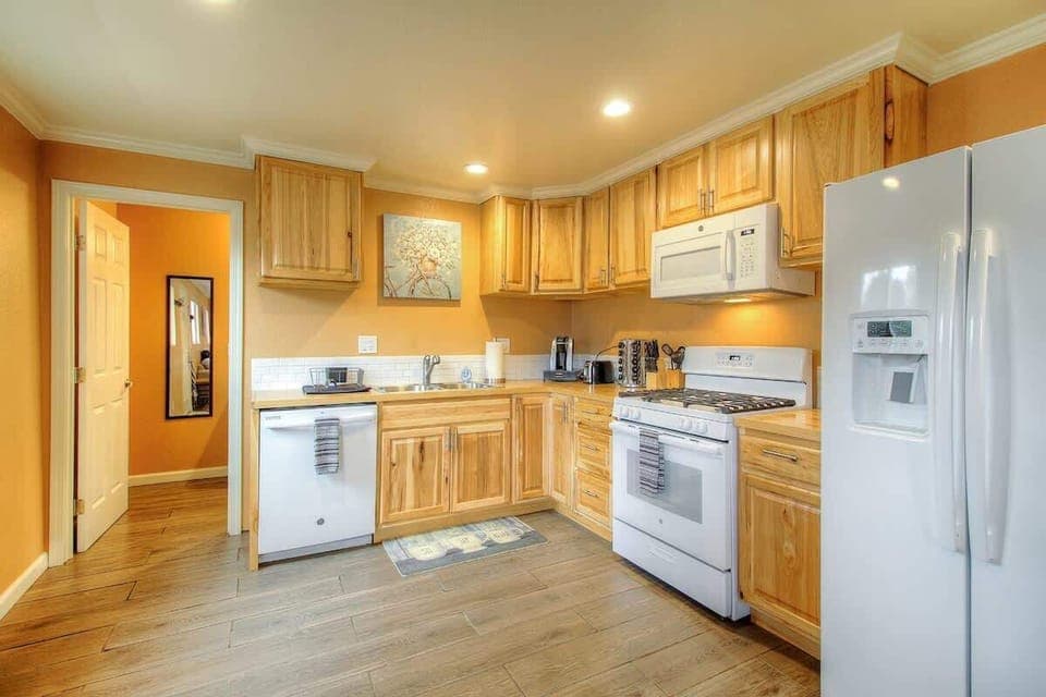 Full sized kitchen stocked with everything you need to prepare a nice meal. Gas range dishwasher and side by side refrigerator with ice and water dispenser. 