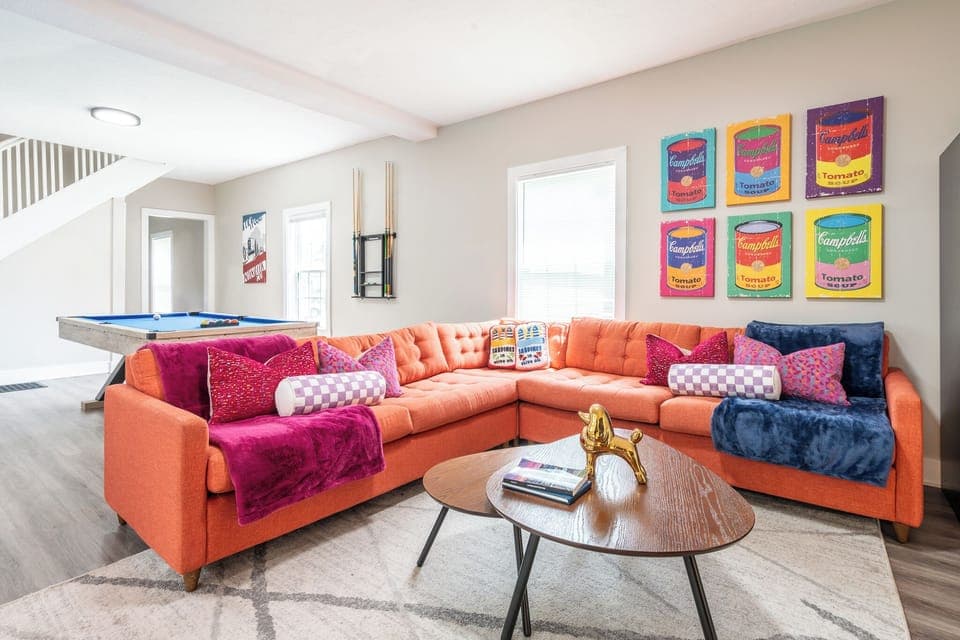 A prominent figure in Pop Art, Andy Warhol wanted to connect art with everyday life. We chose a coral JoyBird couch to highlight one of his most memorable works, the Campbell's Tomato soup can