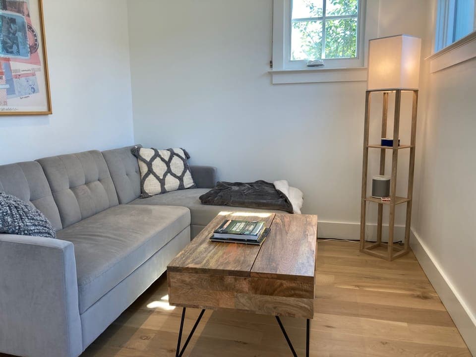 Relax, work, and read in the sunny living room.