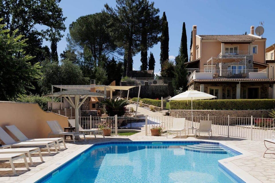 View of the villa from the pool, the perfect summer escape.
