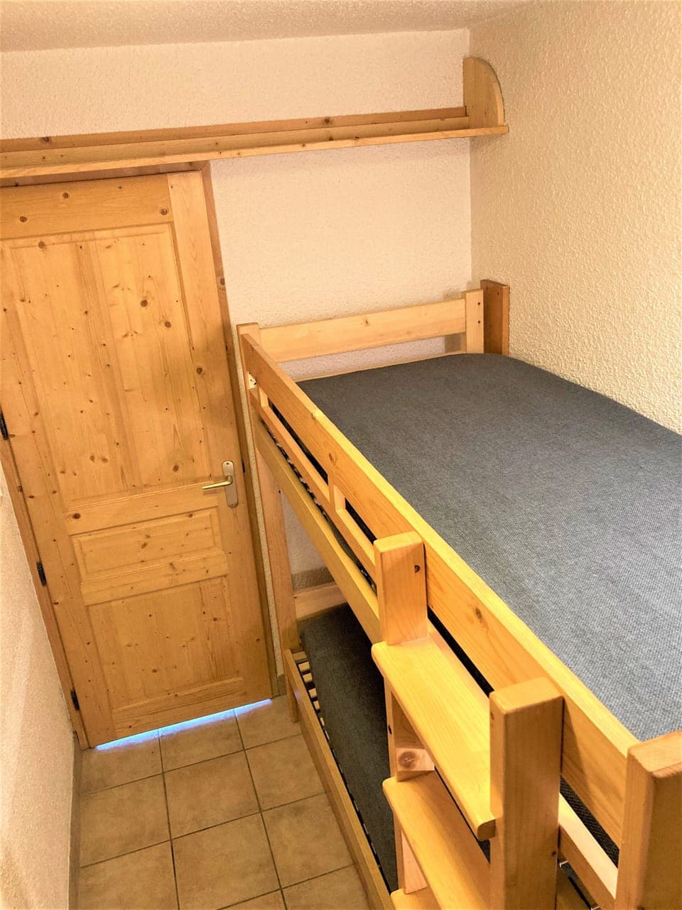 Bunk beds and door to living room