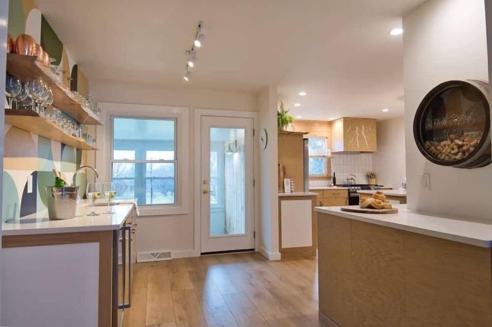 Directly next to the Lounge is our wetbar to the left, kitchen and coffee counter to the right.  Keep your beverages cold in the cooler under the bar counter.