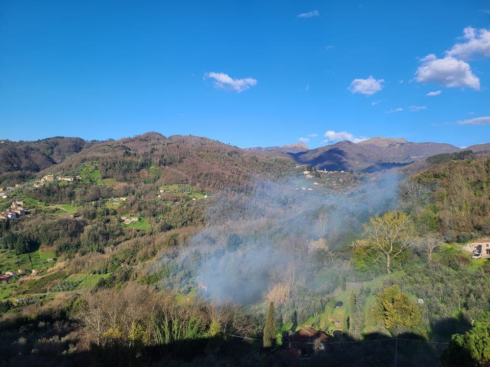The valley view in early  spring with wood smoke from spring land cleaning