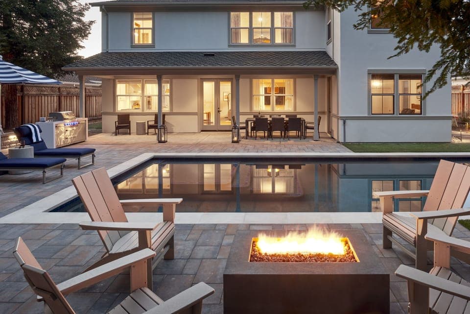 Tranquil backyard w/ heated pool, spa, BBQ & fire pit surrounded by redwoods