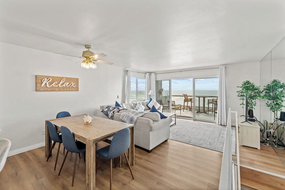 Relax in the spacious living area with stunning ocean views. 