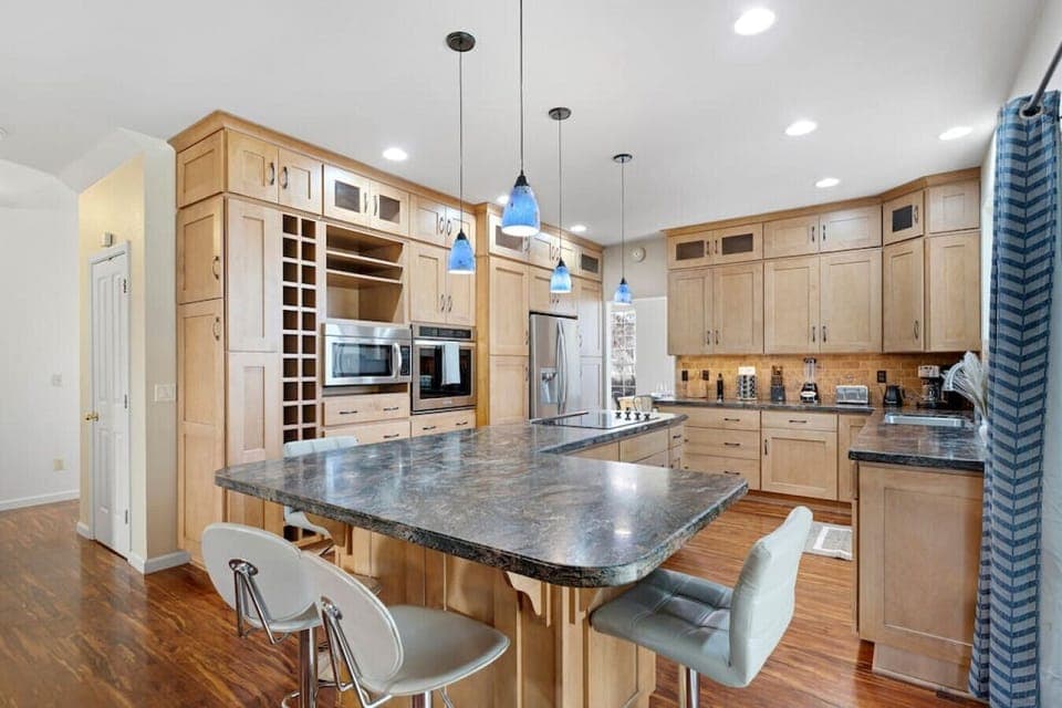 Our open concept kitchen is fully updated with modern counter tops, storage, and appliances.