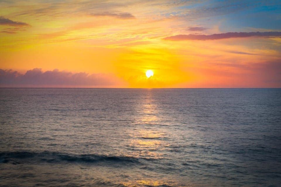 Unforgettable Kona sunsets are your nightly backdrop—best enjoyed from the lanai or spa tub.
