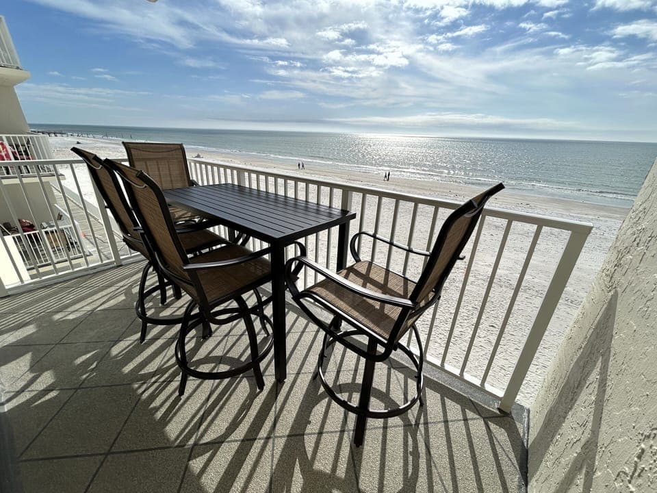 Private beachfront balcony with new patio furniture. Direct ocean views!