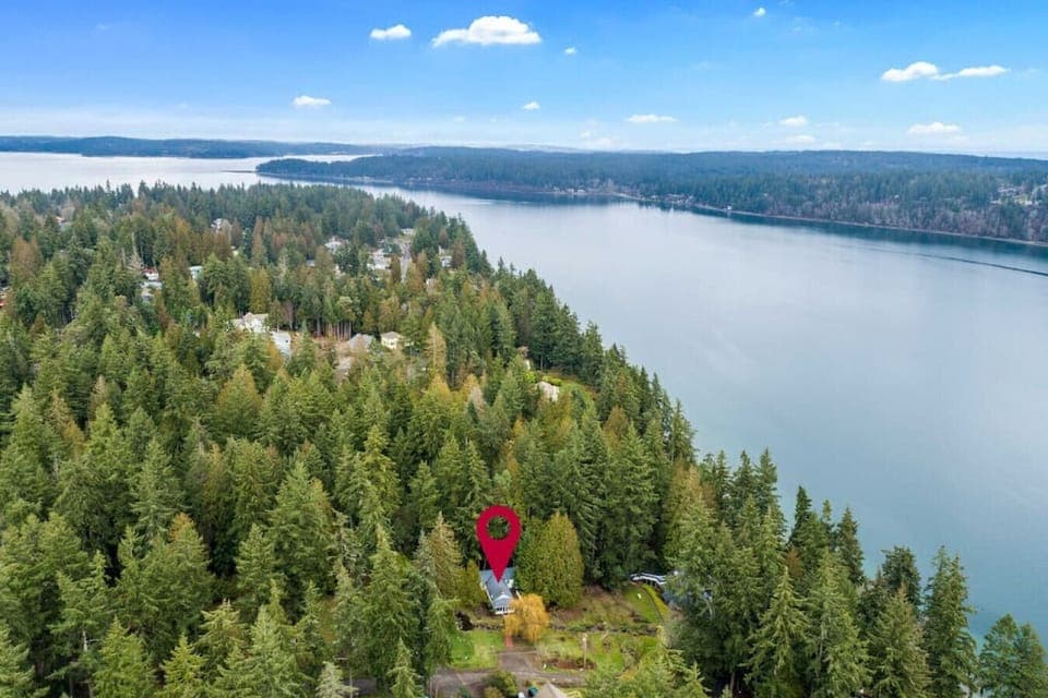 The property is on the water and has a private beach access.