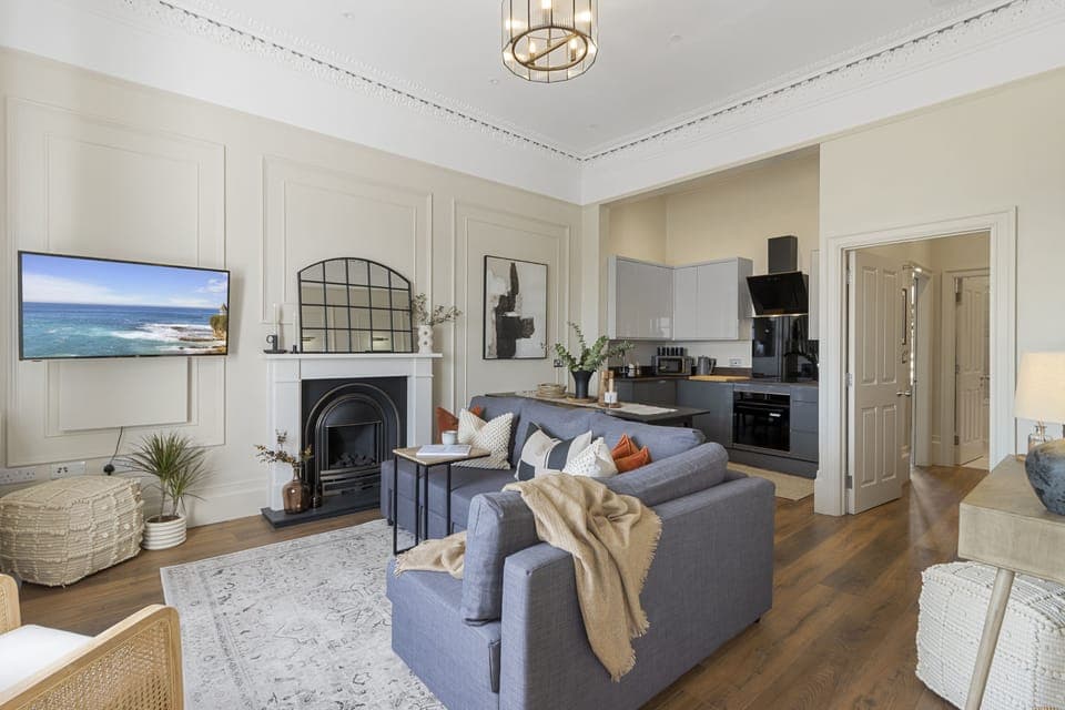 Kitchen, dining area and living room with Smart TV and stunning sea views