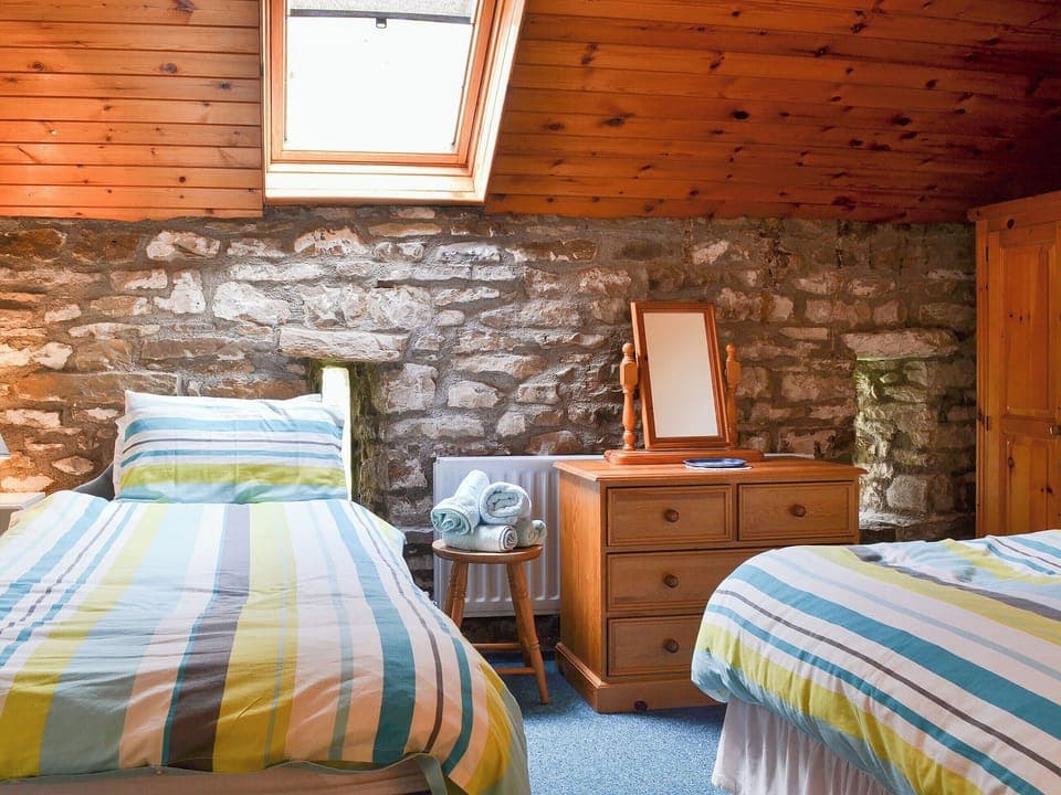 Twin bedded room with exposed stone wall | Yarker Lane Cottage, Mickleton, near Barnard Castle