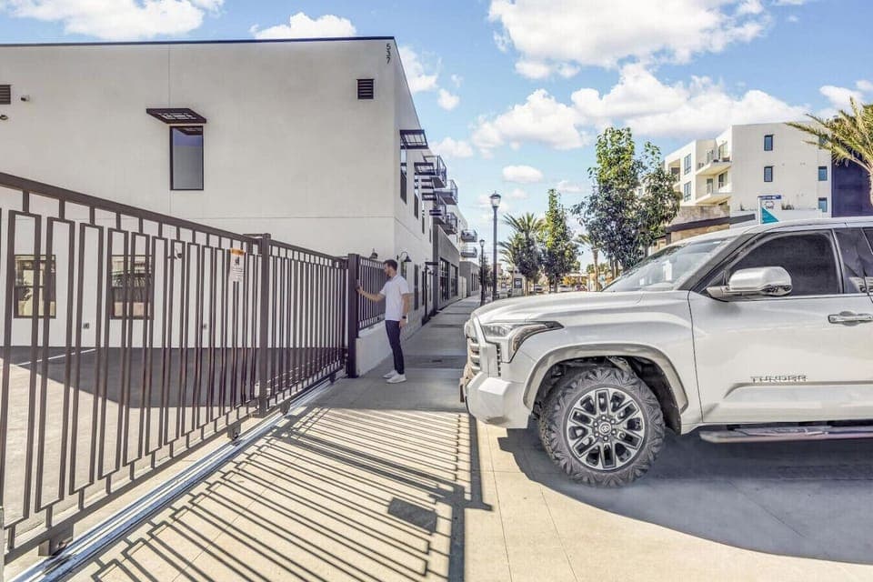 The gate for the private parking with keypad entry.