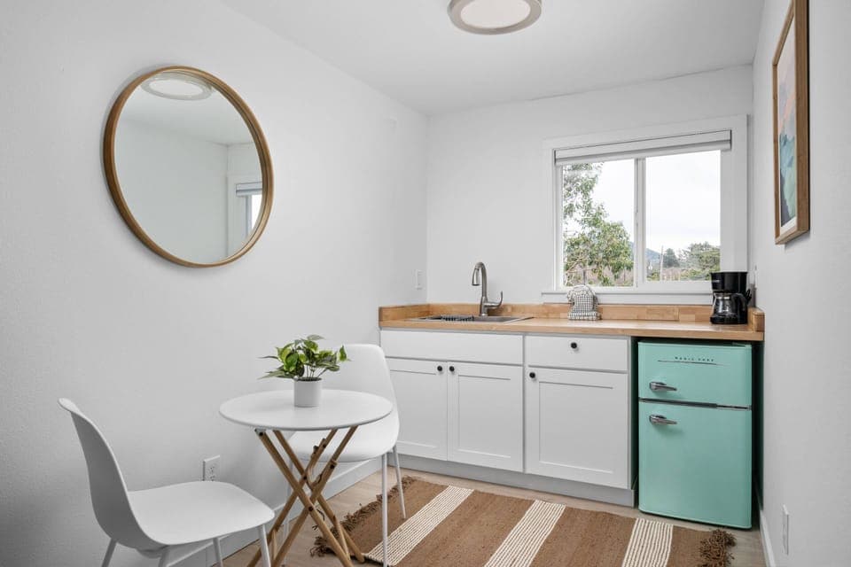 Enjoy a nice meal in the kitchenette area equipped with a mini-fridge, coffee maker, and microwave.