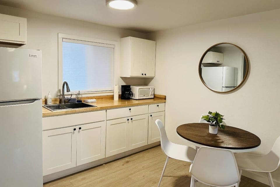 Enjoy a nice meal in the kitchenette area equipped with a mini-fridge, coffee maker, and microwave.