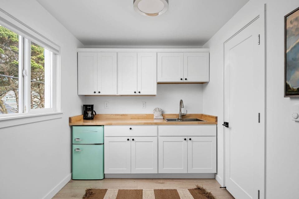 Enjoy a nice meal in the kitchenette area equipped with a mini-fridge, coffee maker, and microwave.