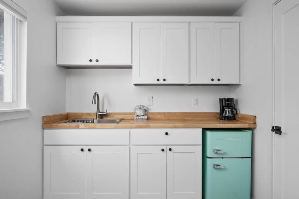 Enjoy a nice meal in the kitchenette area equipped with a mini-fridge, coffee maker, and microwave.