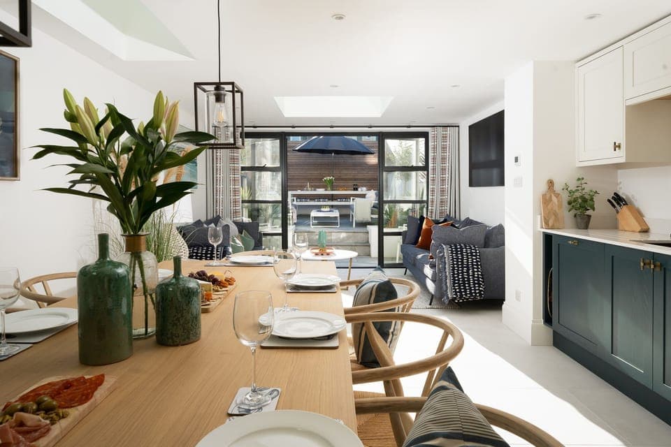 Open-plan kitchen/living/dining room opens up to rear courtyard