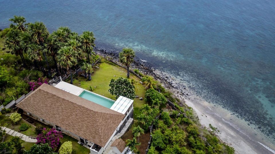 Drone view of the villa and natural surroundings 