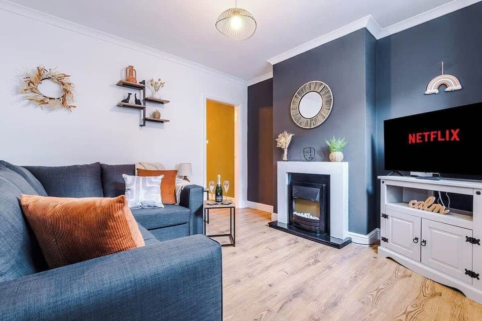 The modern living room benefits from a large corner sofa which can be converted into a double sofa bed, a 40-inch SMART TV with Netflix and plenty of space to sit down and relax.