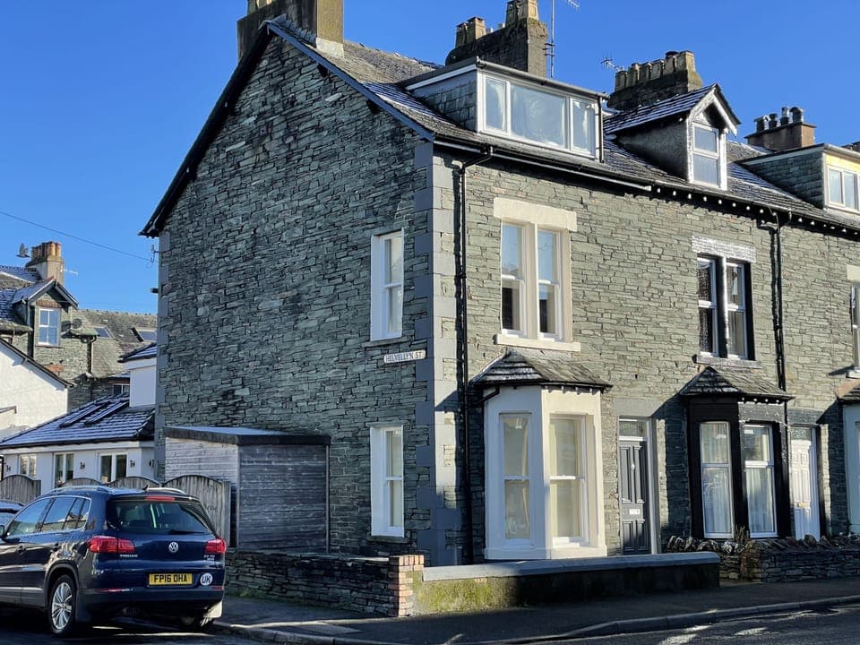 The property is an attractive end-terrace house built with locally mined slate stone