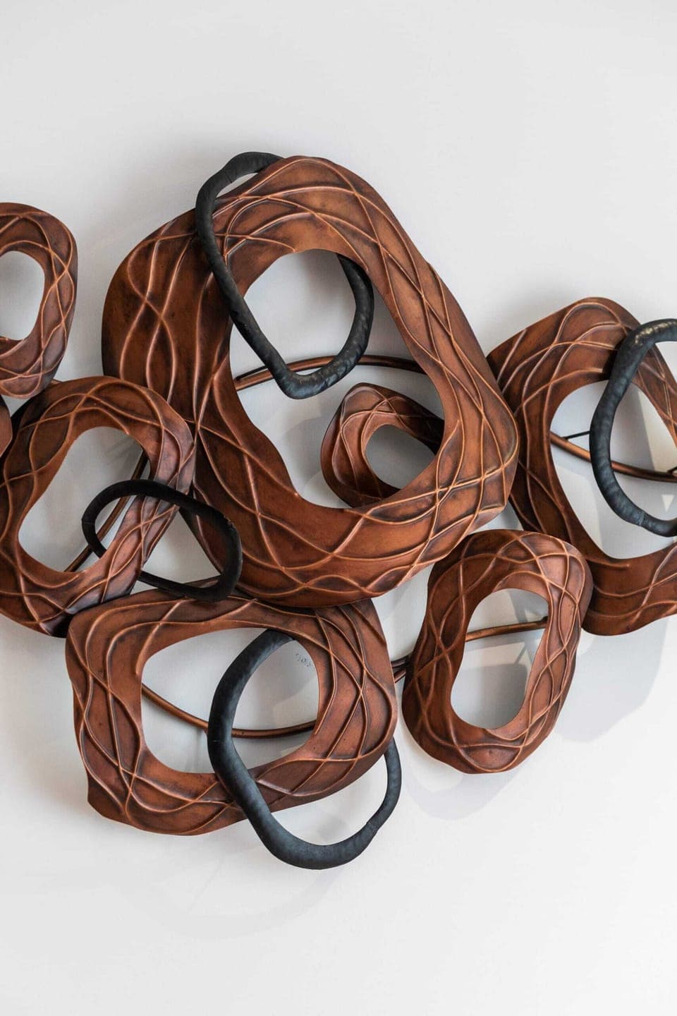 A close-up of intricate wall art in the bedroom, adding a stylish touch.
