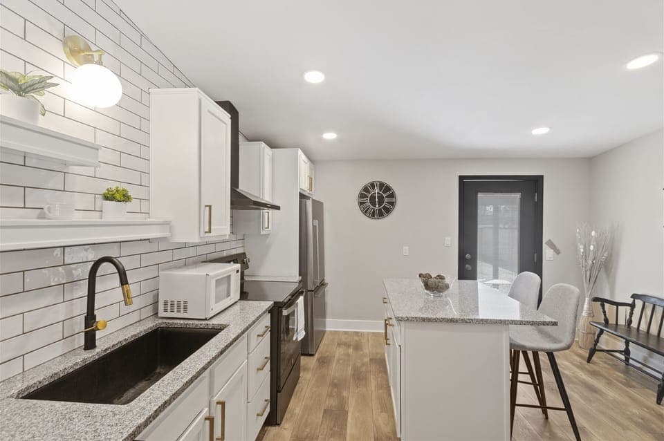 Kitchen cabinetry stocked with cooking & dining essentials