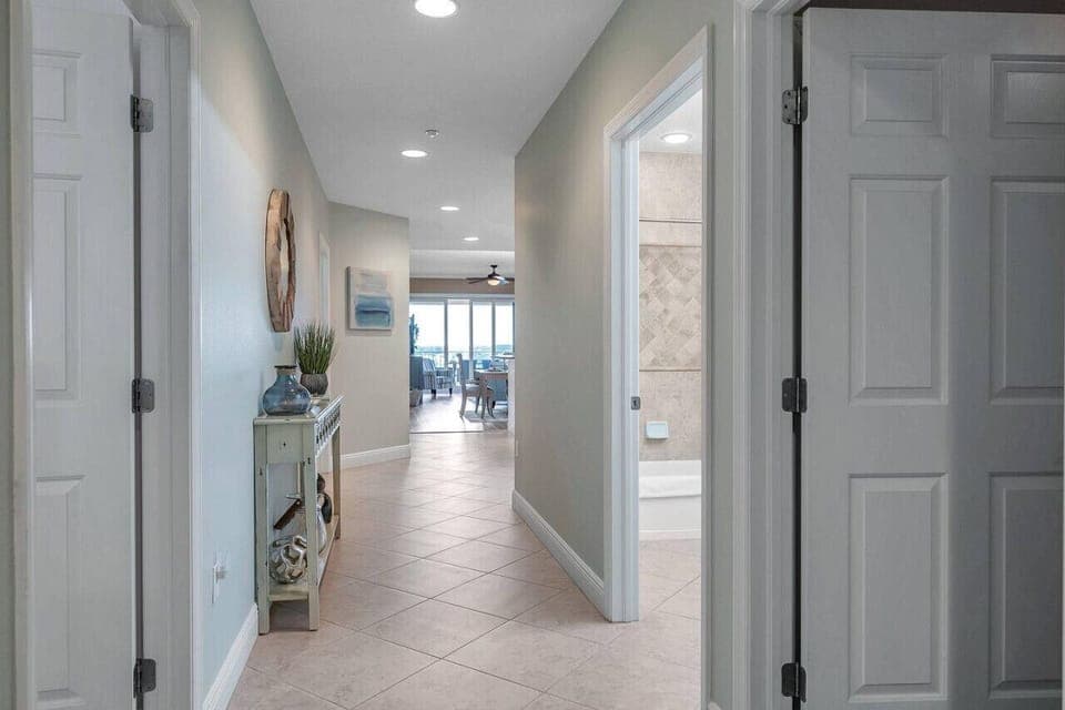 Bright hallway w/ clean lines & easy flow connecting the bedrooms & living spaces.