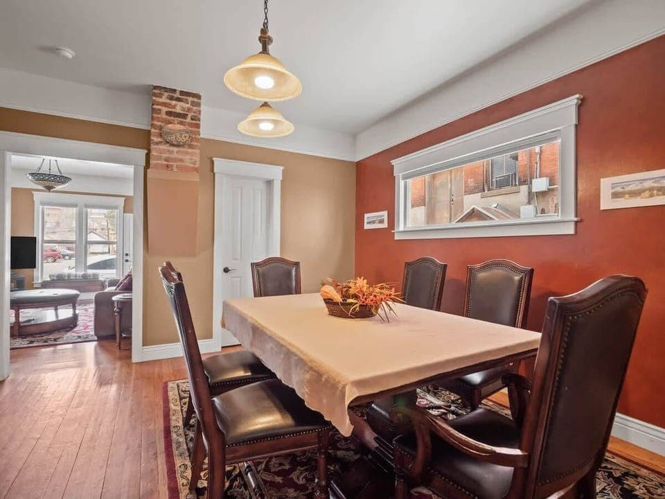 【Dining — Third Angle】 Table-for-eight — runs both family meals and evening games.