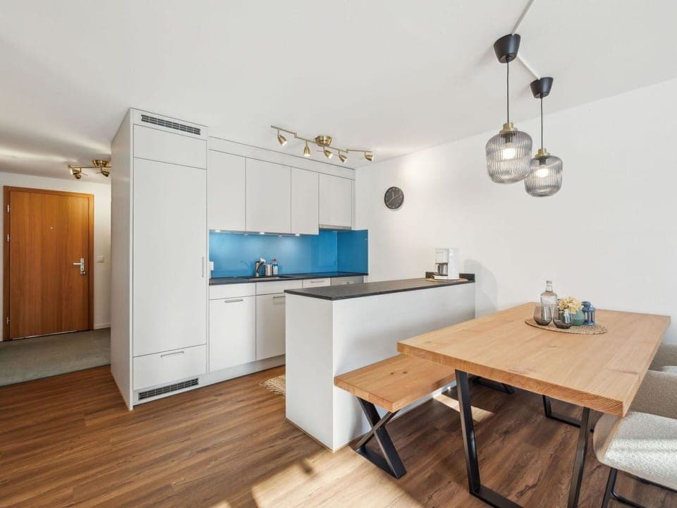 Furniture, Interior Design, Flooring, Kitchen, Floor, Countertop, Wood, Ceiling, Room, Cabinetry