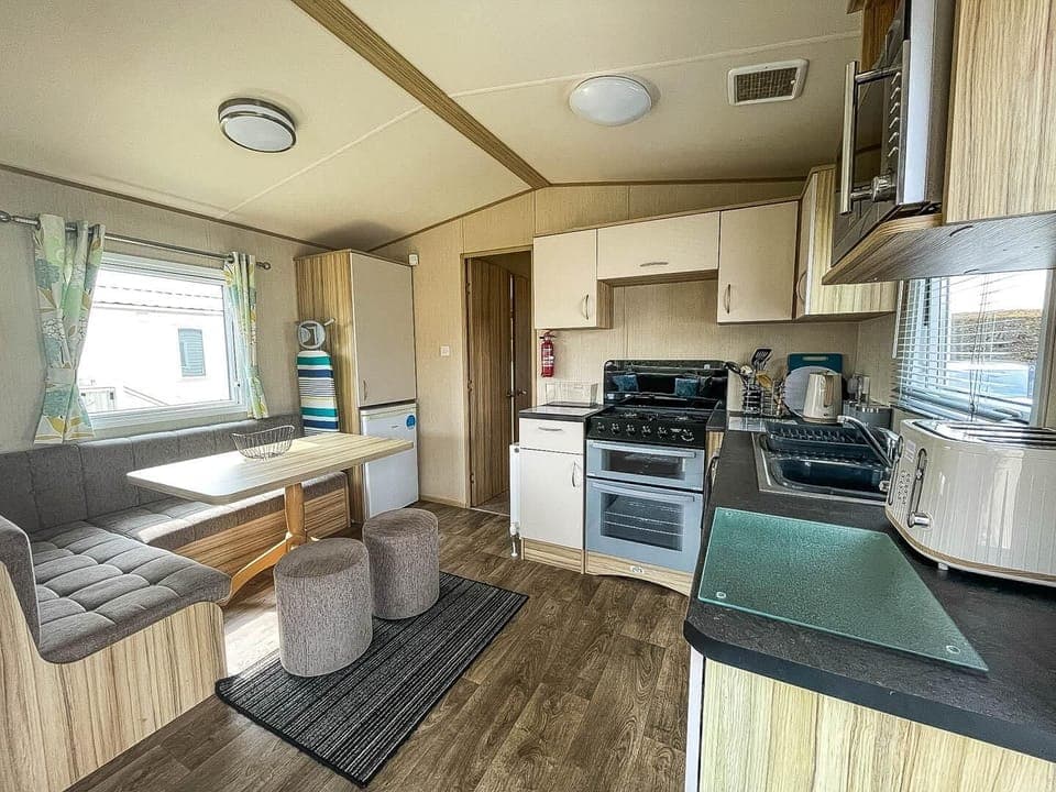 Parkdean Resorts Southview Holiday Park Skegness, located in the charming seaside town of Skegness in England, is a top choice for romantic getaways UK, offering cosy caravans with a comfortable kitchen area.