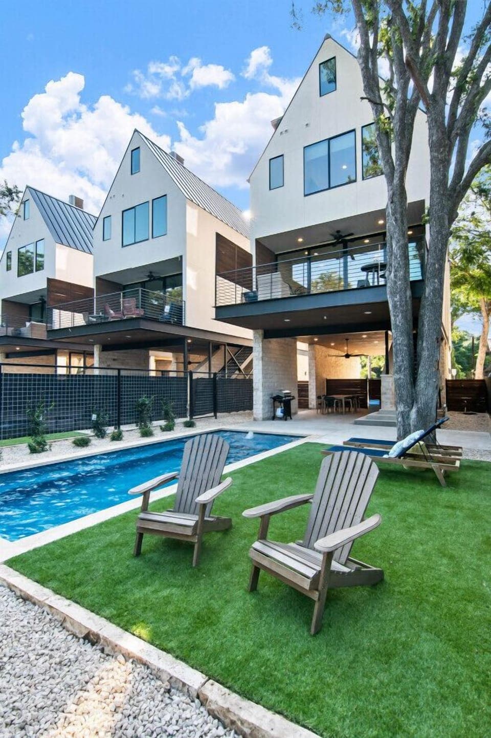 Karnau Haus at Camp Warnecke-Heated pool with outdoor seating and Comal River views