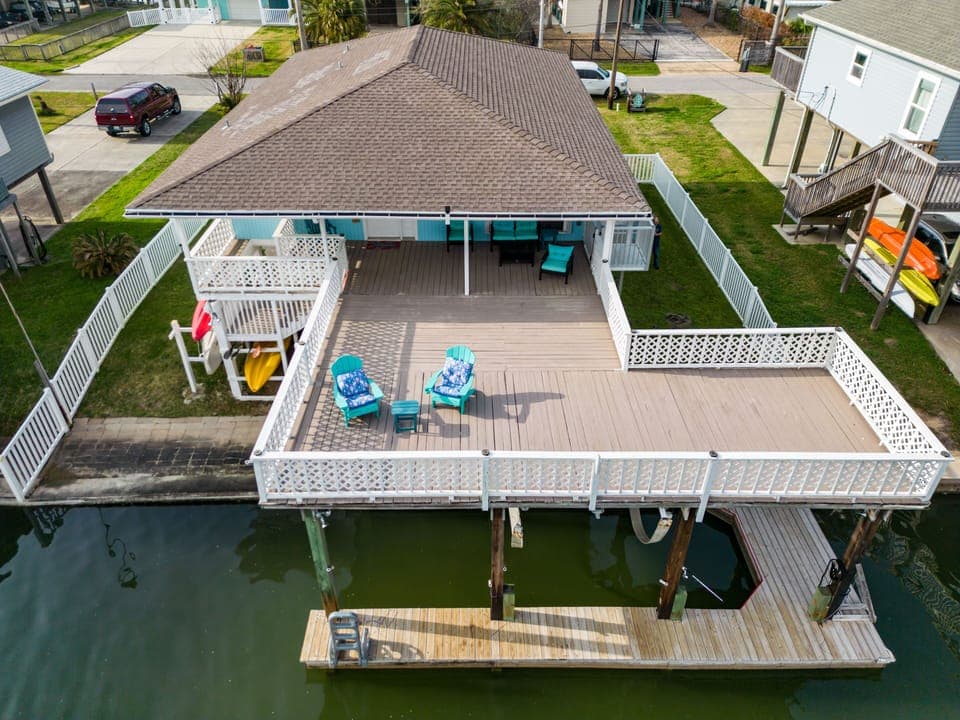 Relax on the spacious deck with vibrant seating and serene water views!