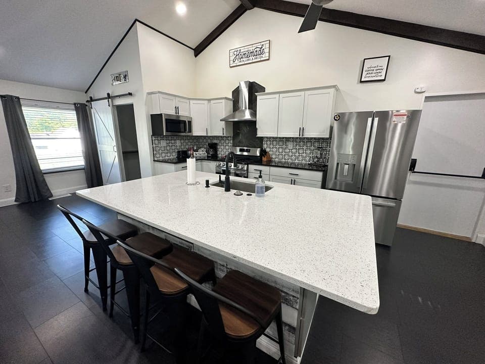 Fully Stocked Kitchen with Island Seating.