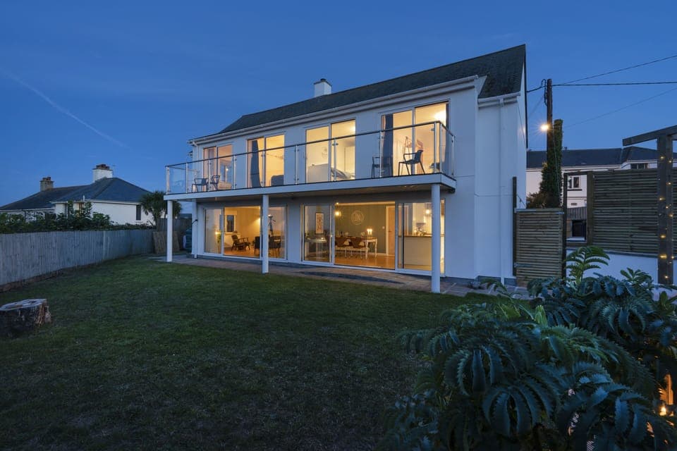 Night time shot of property with secure gated garden.
