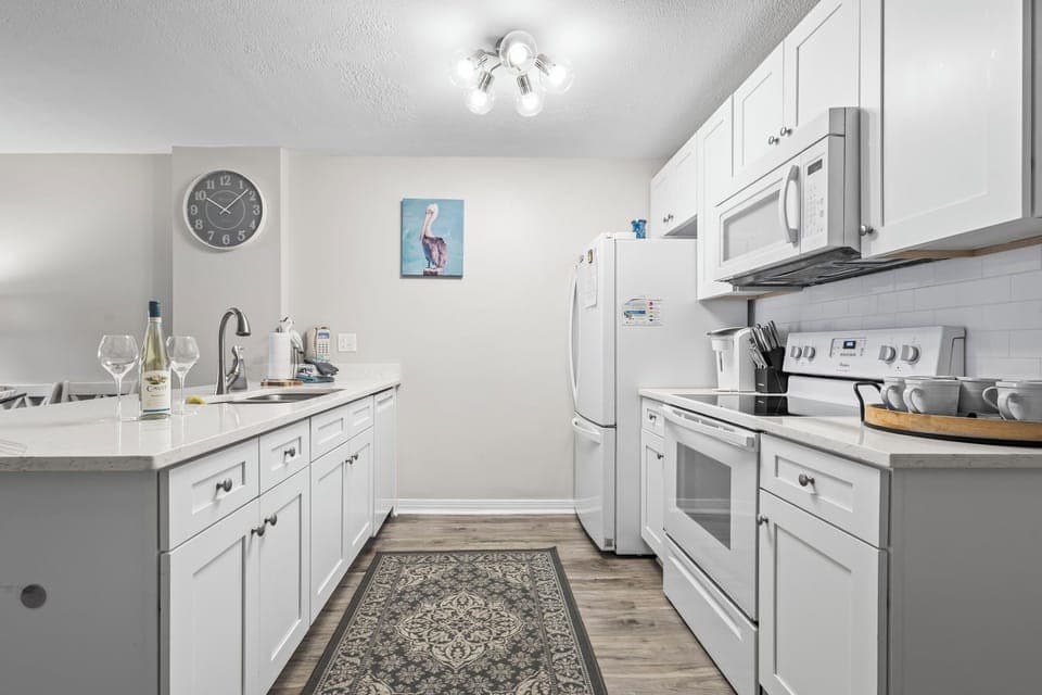 Fully equipped kitchen with modern appliances—perfect for home-cooked meals.