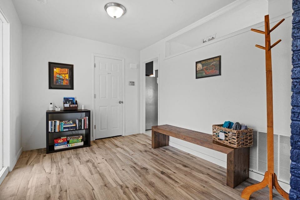 The entryway glows with abundant natural light, creating a warm and inviting atmosphere. Welcome to your home away from home!