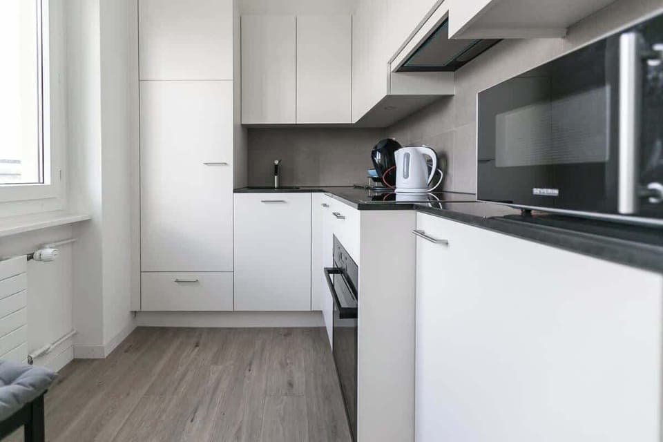 Modern kitchen with integrated oven and microwave