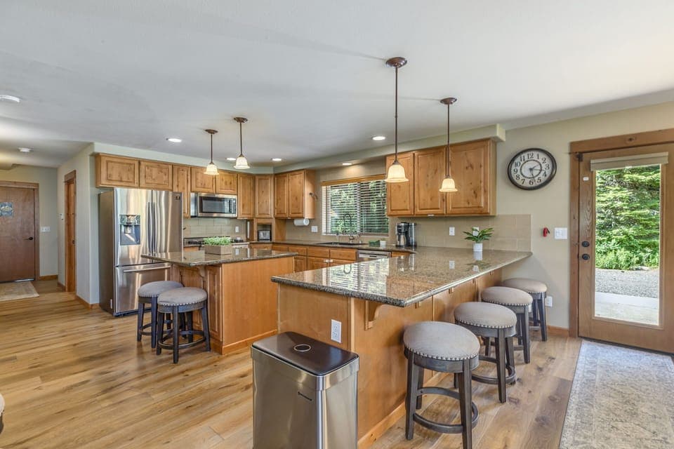 Fully Stocked Chef's Kitchen with 6 burner Gas Range, Granite Countertops, and Modern Appliance