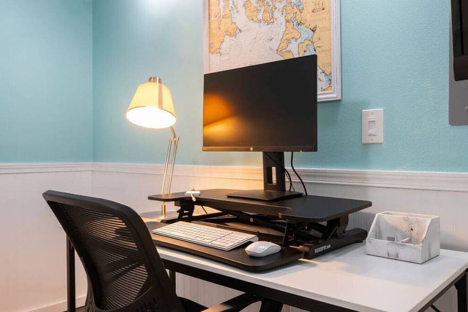 Desk, monitor, mouse, keyboard, and convertible sit/stand is provided so you can easily work while you are away.