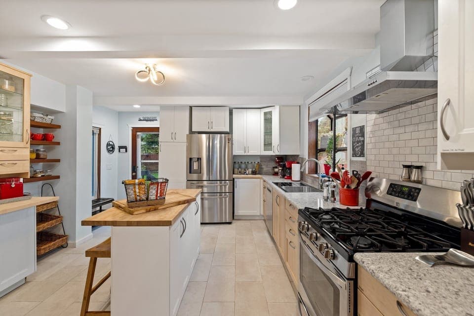 Our brightly lit gourmet kitchen is a culinary haven where every detail is designed to elevate your cooking experience.