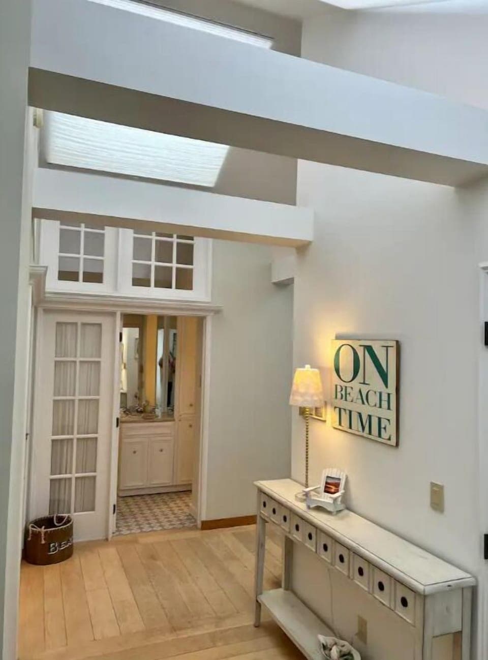 Entry hall view. Entrance to 3/4 guest bathroom in distance. So light 'n bright!