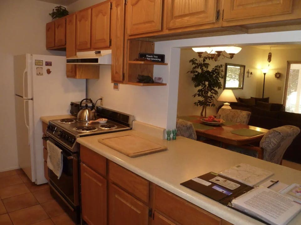 Right Side of Kitchen (Left side with Sink, Cabinetry, and Laundry Closet)