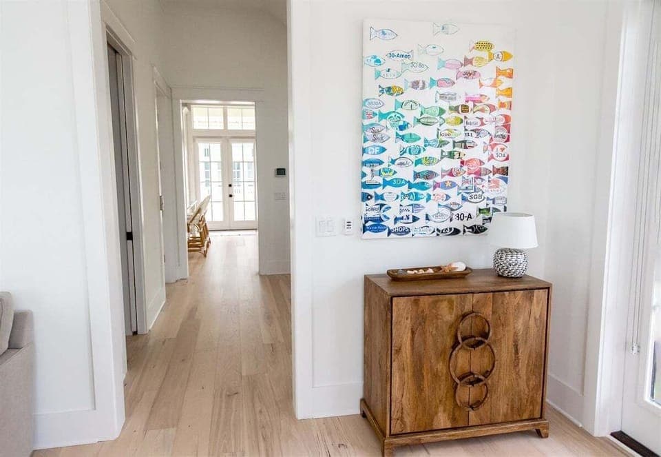 A beautifully designed hallway with charming art and modern touches.