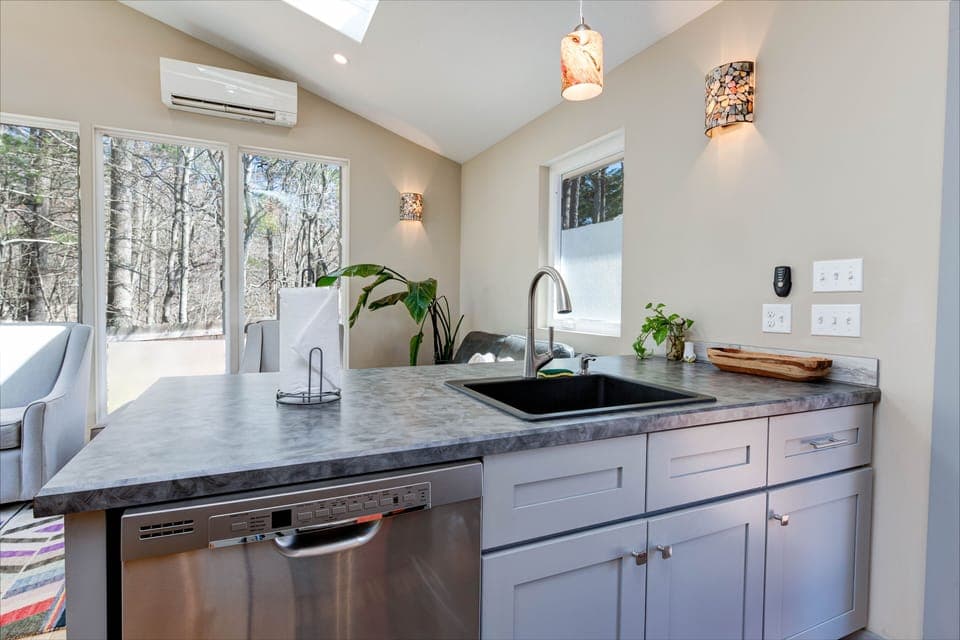 A modern kitchen and living space perfect for small groups.